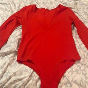 Red long sleeve body suit